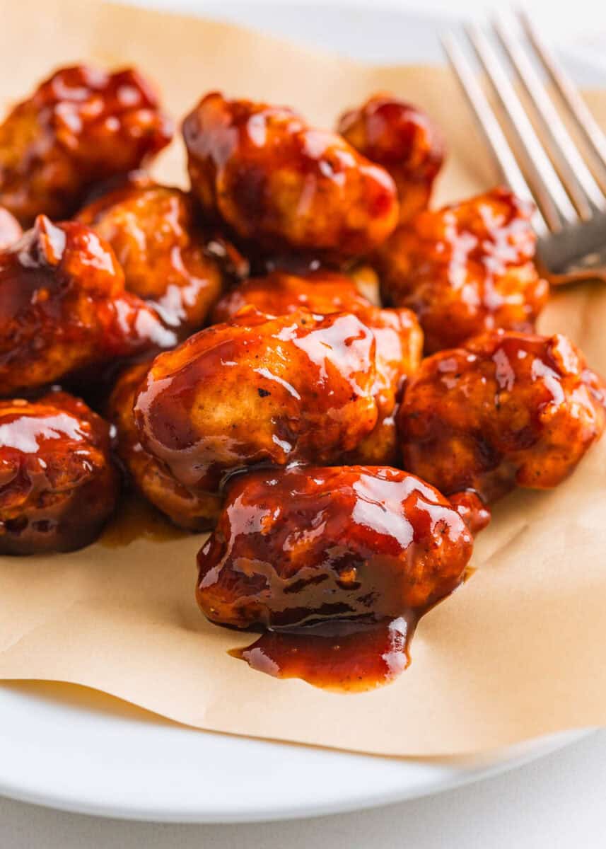 Boneless chicken wings coated in barbecue sauce.