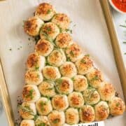 Christmas tree pull apart bread on a baking sheet.