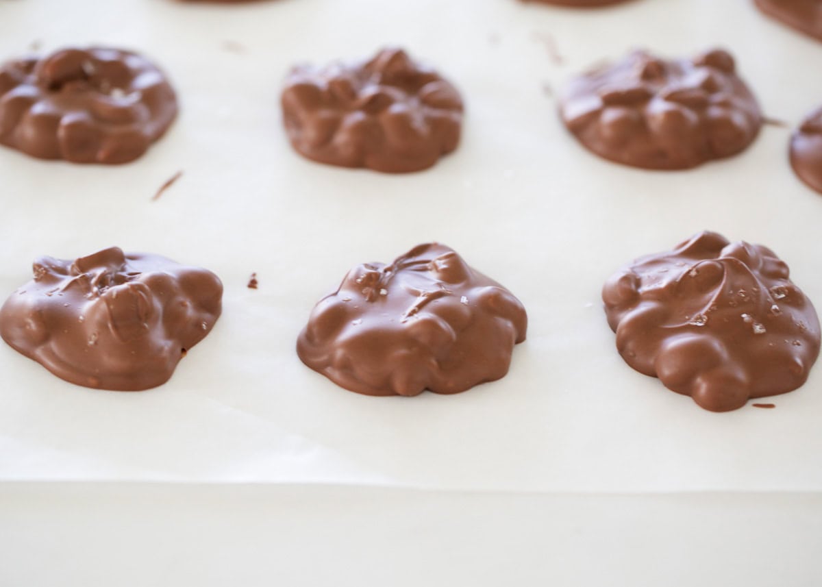 Crockpot candy on a piece of parchment paper.