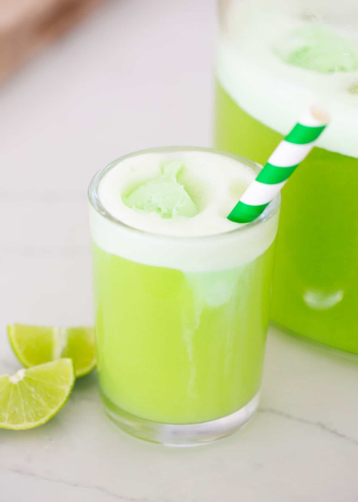 Green punch in a glass cup.