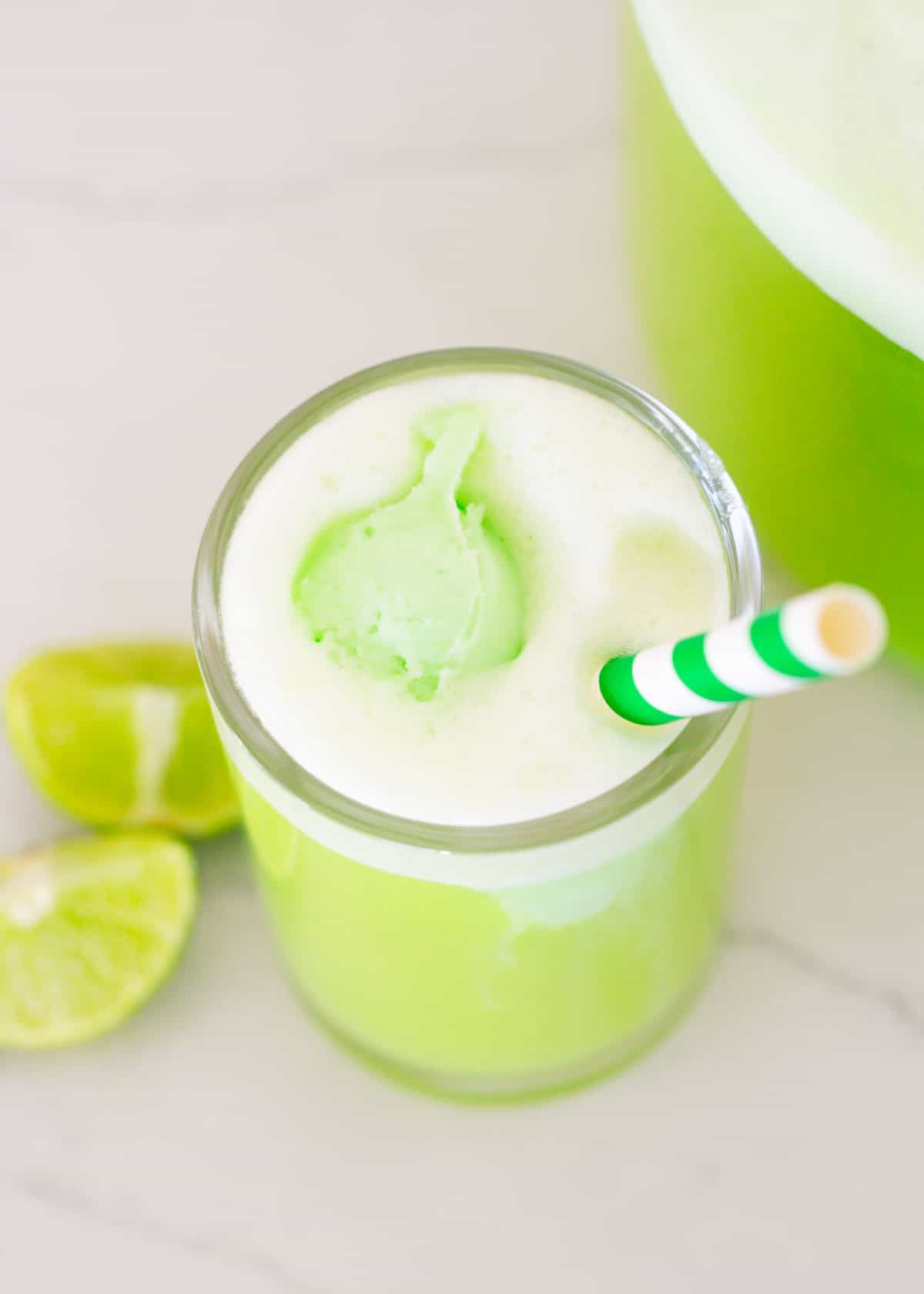 Green punch in a glass cup.