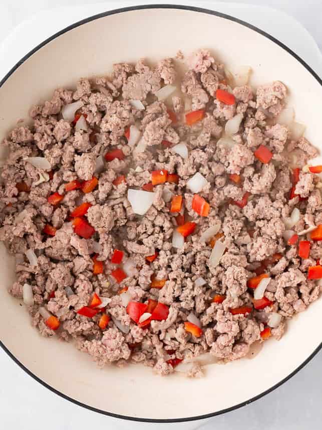 Ground turkey, bell pepper and onion in a skillet.