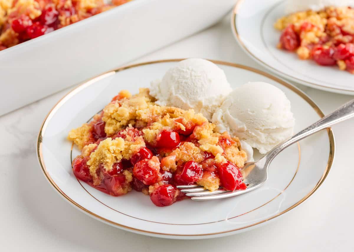 Cherry dump cake on a plate.