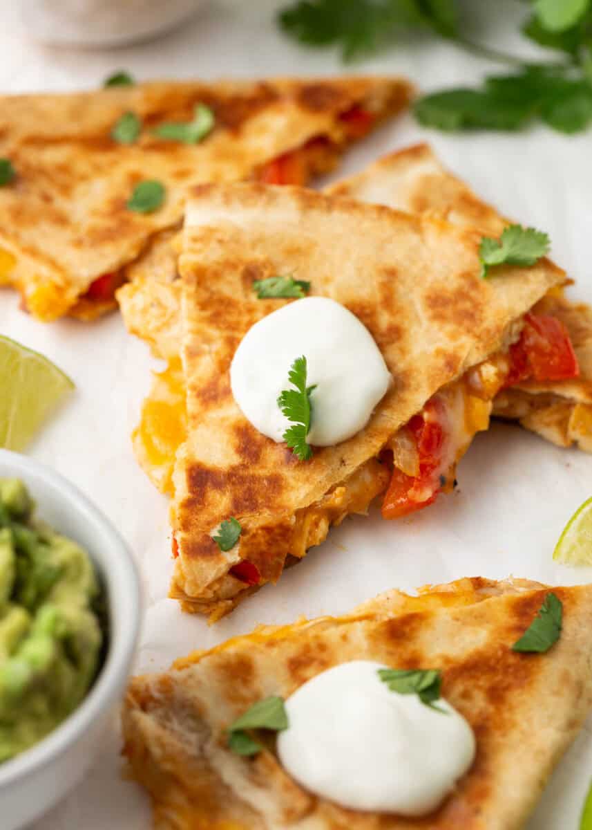 Chicken quesadilla cut into pieces on the counter.