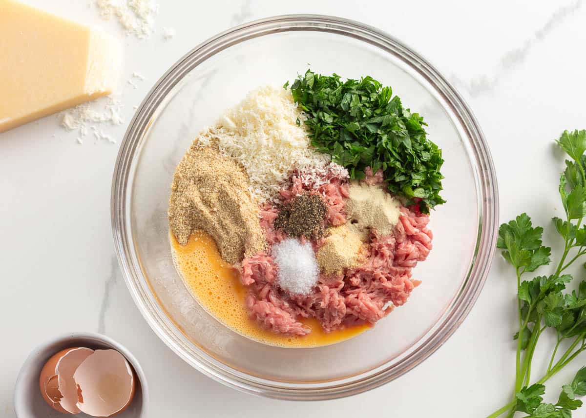 Showing how to make turkey meatballs.