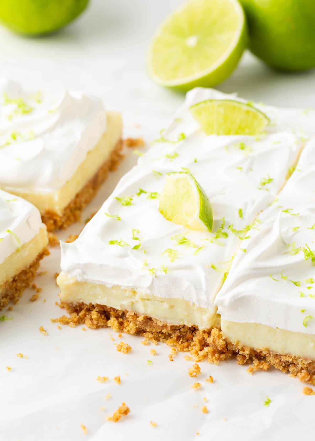 Key lime bars with whipped cream.