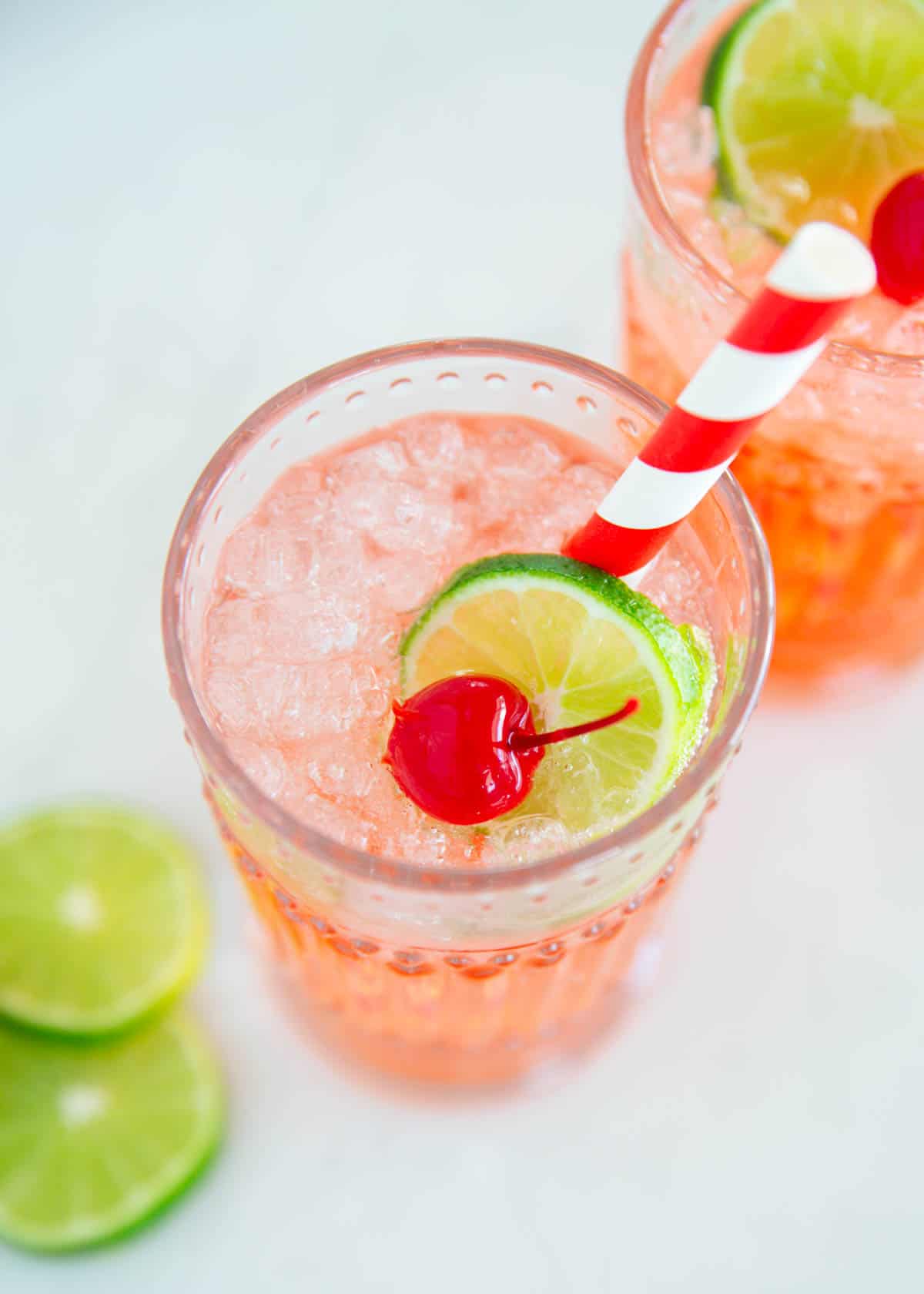 Cherry limeade in a glass cup.