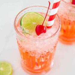 Cherry limeade in a glass cup.