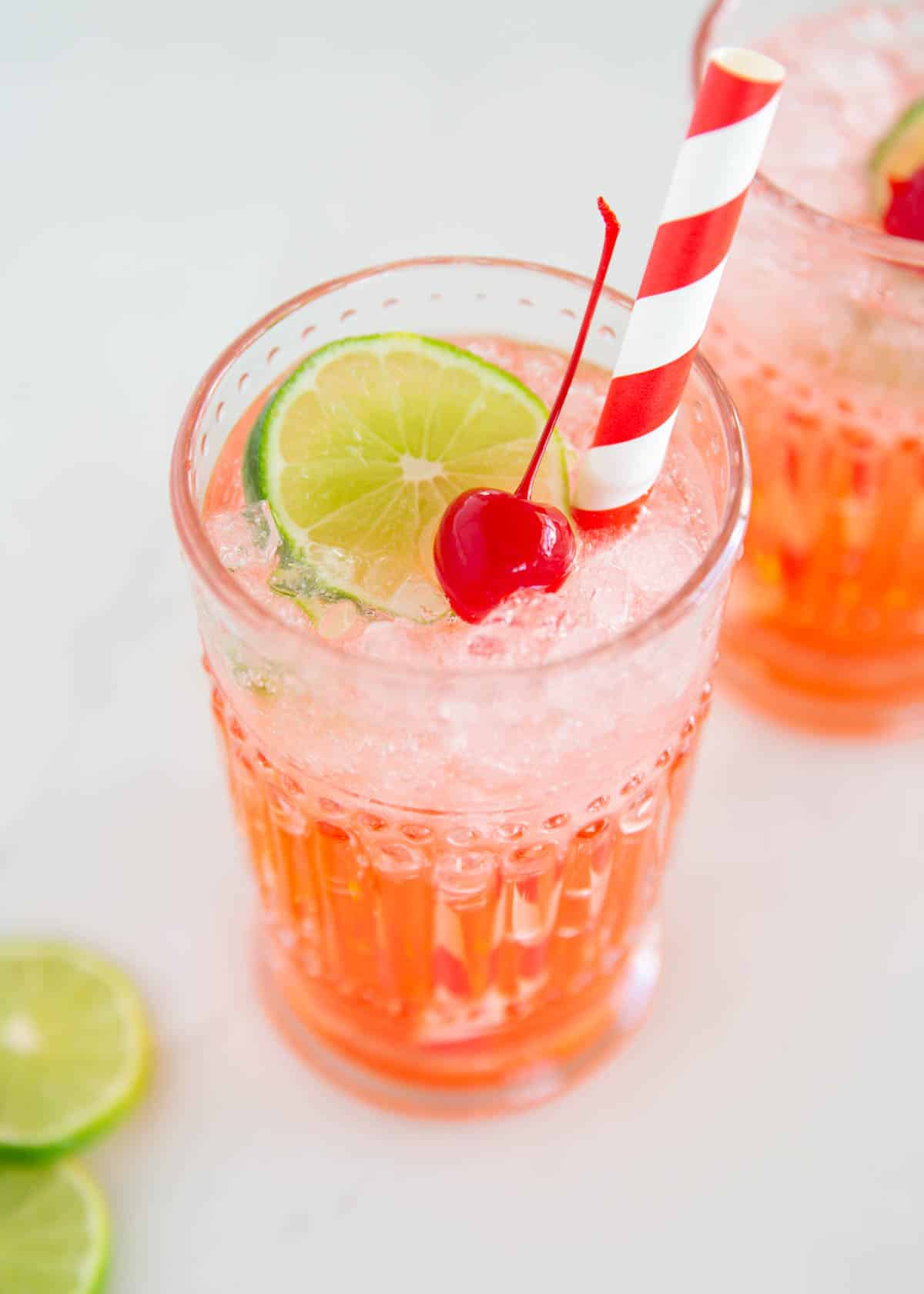 Cherry limeade in a glass cup.