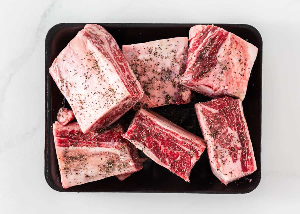 Beef short ribs with salt and pepper.