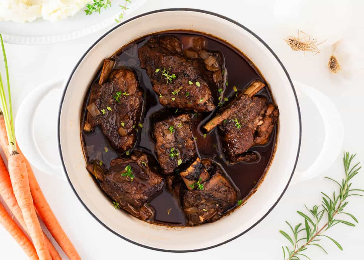 Cooked braised short ribs in a Dutch oven.