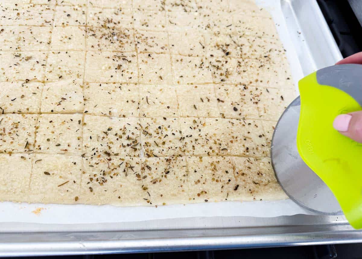 Cutting sourdough crackers.