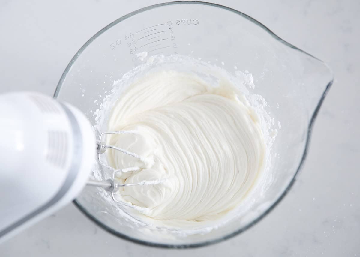 Showing how to make sugar cookie frosting.