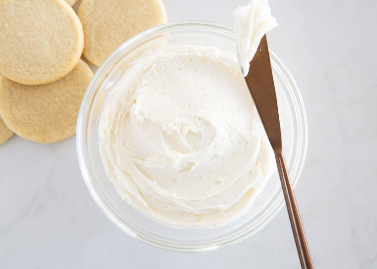 Sugar cookie frosting in a glass bowl.