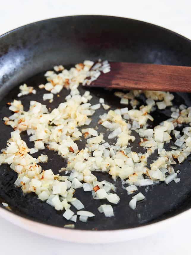 Sauteing onion in a skillet.