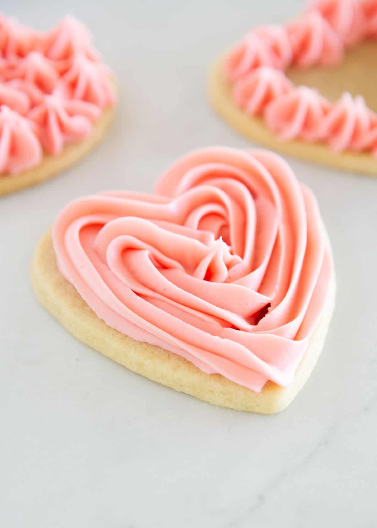 Valentine sugar cookies with pink frosting.