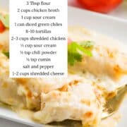 White chicken enchiladas on a plate with ingredients listed.